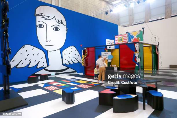 Parent takes a child to experience the "People of Tomorrow" interactive installation exhibition designed by French artist Jean Charles de...