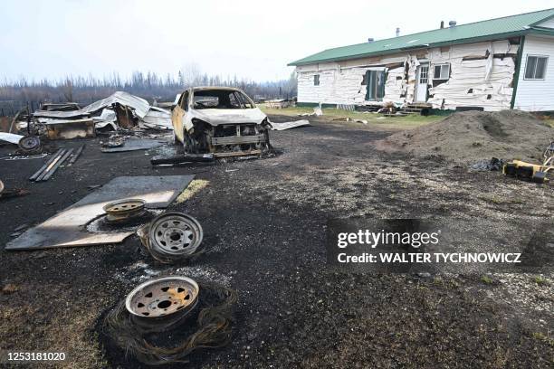 Damage is seen on the property of Adam Norris in Drayton Valley, Alberta, Canada, on May 8, 2023. - Canada struggled on Monday to control wildfires...