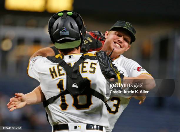 Mitch Keller of the Pittsburgh Pirates celebrates with Austin Hedges after pitching a complete game shut out against the Colorado Rockies at PNC Park...