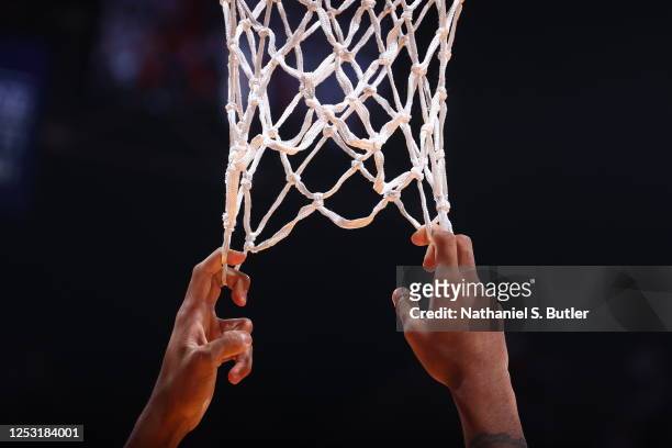 Generic basketball photo of players hanging on the net during Game Four of the Eastern Conference Semi-Finals of the 2023 NBA Playoffs between the...