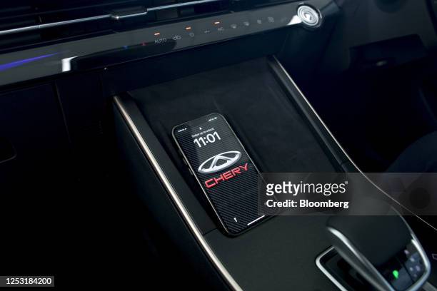 Wireless phone charging module inside a Chery Automobile Co. Omoda 5 vehicle at a dealership in Sydney, Australia, on Thursday, May 4, 2023. Chery is...