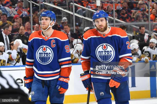 Connor McDavid and Leon Draisaitl of the Edmonton Oilers await a face-off in Game Three of the Second Round of the 2023 Stanley Cup Playoffs against...