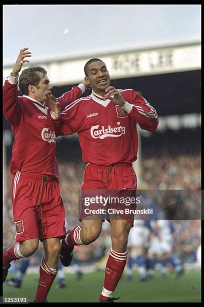 Stan Collymore of Liverpool celebrates with teammate Jason McAteer after his goal against Blackburn Rovers in FA Carling Premier league match at...