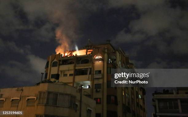 Fire breaks out in an apartment following an Israeli strike in Gaza City, Palestinian Territories, on May 9, 2023.