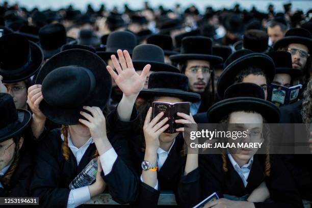 Ultra-Orthodox Jews pray at the gravesite of Rabbi Shimon Bar Yochai at Mount Meron in northern Israel on May 9 during the Jewish holiday of Lag...