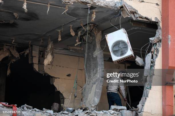 Damaged building is pictured after an Israeli airstrike in Gaza City, Palestininan Territories on May 9, 2023. - Israel launched pre-dawn air strikes...