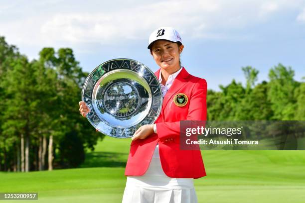 Ayaka Watanabe of Japan poses with the trophy after the award ceremony following the final round of the Earth Mondamin Cup at the Camellia Hills...