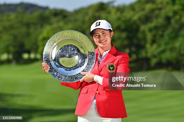 Ayaka Watanabe of Japan poses with the trophy after the award ceremony following the final round of the Earth Mondamin Cup at the Camellia Hills...