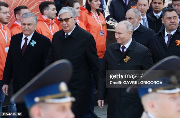 Russian President Vladimir Putin, accompanied by Uzbek President Shavkat Mirziyoyev, Kazakh President Kassym-Jomart Tokayev, Armenian Prime Minister...