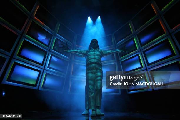 Dancers from the Pilobolus Dance Theatre perform in the "Ambilight TV" stand of Dutch electronics giant Philips at Berlin's IFA Consumer Electronics...