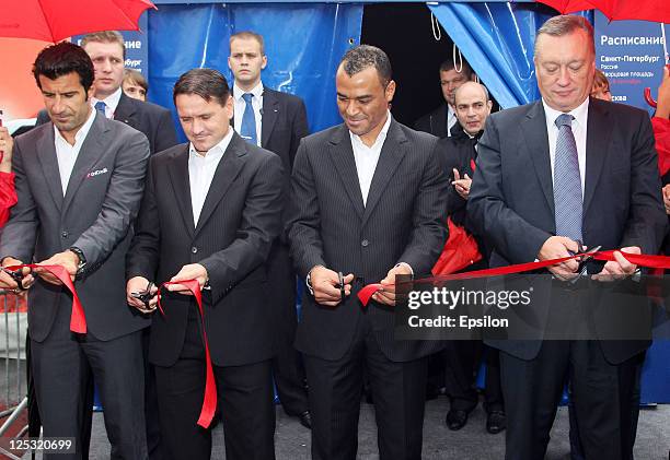 Luis Figo, Dmitri Alenichev, Cafu and Vadim Tulpanov cut tape during opening ceremony of the UEFA Champions League Trophy Tour 2011 on September 16,...