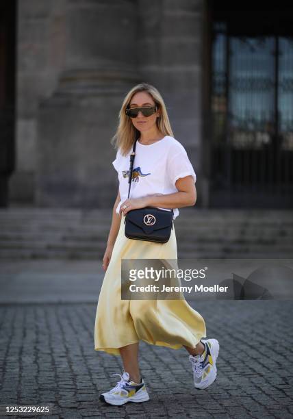 Sonia Lyson wearing Zara skirt and shirt, Axel Arigato sneaker, Louis Vuitton Pont 9 bag and Linda Farrow shades on June 27, 2020 in Berlin, Germany.
