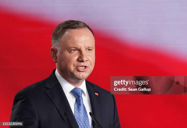 Polish President and member of the right-wing Law and Justice party Andrzej Duda speaks to supporters following initial results in the Polish...