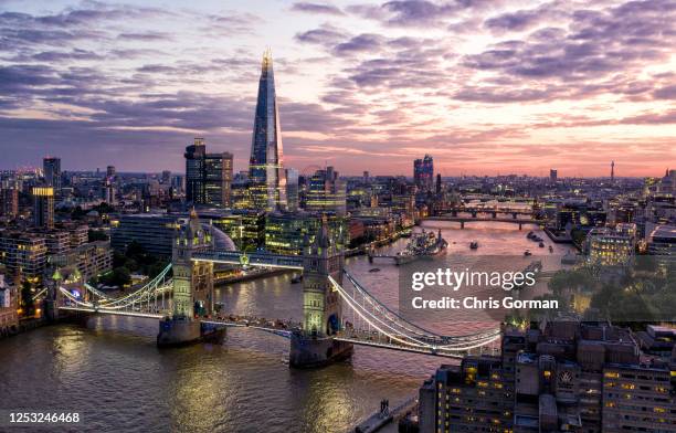 View of the sky line including Tower Bridge and the Shard at dusk on July 14 2019 in London,England.