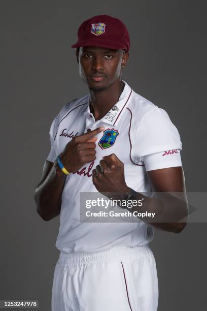 West Indies captain Jason Holder points at the Black Lifes Matter massage on his shirt as he poses for a portrait at Emirates Old Trafford on June...