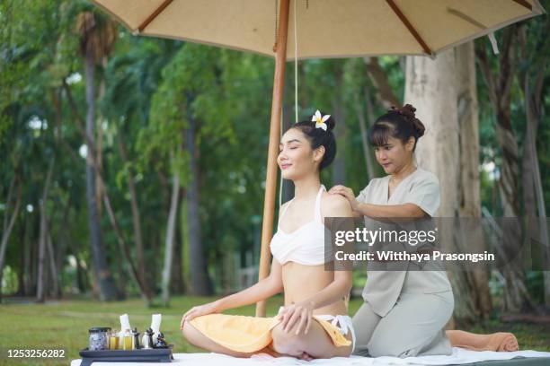 serenity at the spa - thai people stock pictures, royalty-free photos & images