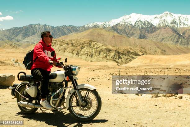 rider on motorbike - indian riding stock pictures, royalty-free photos & images