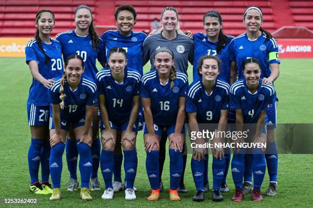 Philippines' captain Hali Long poses with teammates before the start of the women's football match between Vietnam and Philippines at RSN Stadium...