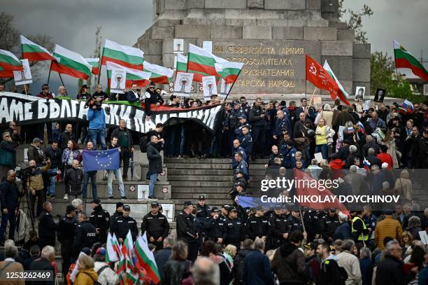 Anti-Russia demonstrators with Bulgarian and EU flags confront people taking part in a celebration of Victory Day in front of the Soviet Army...
