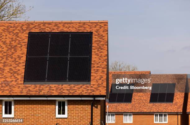 Photovoltaic solar panels on the roofs of houses at the Lenham Springs development in Lenham, UK, on Wednesday, May 3, 2023. Key measures for the...