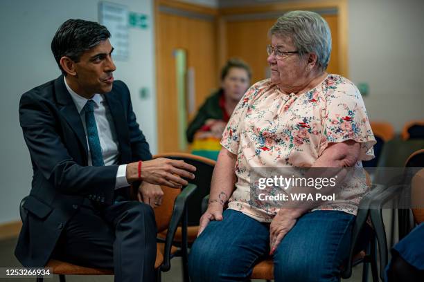 Prime Minister Rishi Sunak chats with patients and meets staff during a visit to a GP surgery and pharmacy in Weston, on May 9, 2023 in Southampton,...