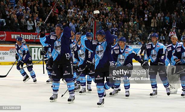 The team of Hamburg celebrate after the DEL match between Hamburg Freezers and Adler Mannheim at the O2 World Arena on September 16, 2011 in Hamburg,...