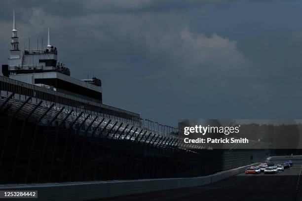 Drivers race in front of the empty spectator grandstand during the NASCAR Xfinity Series Pocono Green 225 Recycled by J.P. Mascaro & Sons at Pocono...