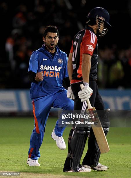 Virat Kohli of India celebrates taking the wicket of Alastair Cook of England during the 5th Natwest One Day International Series match between...