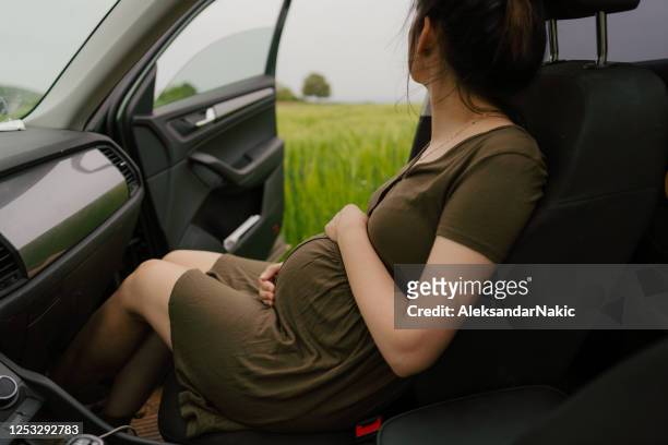 getting away from it all - pregnant woman car stock pictures, royalty-free photos & images