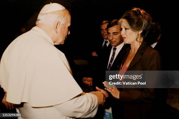 Pope John Paul II meets French actress Brigitte Bardot at his private library in the Apostolic Palace on September 27, 1995 in Vatican City, Vatican