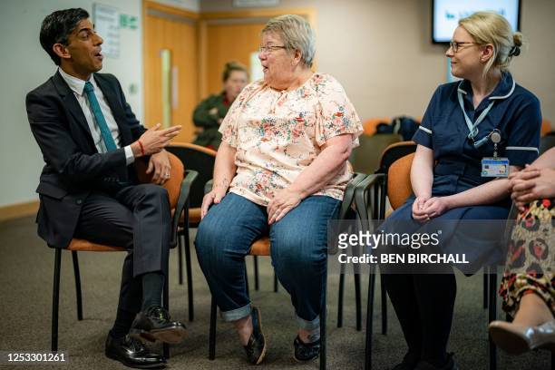 Britain's Prime Minister Rishi Sunak talks with patients and staff during a visit to a doctor's GP surgery and pharmacy in Weston, southern England...