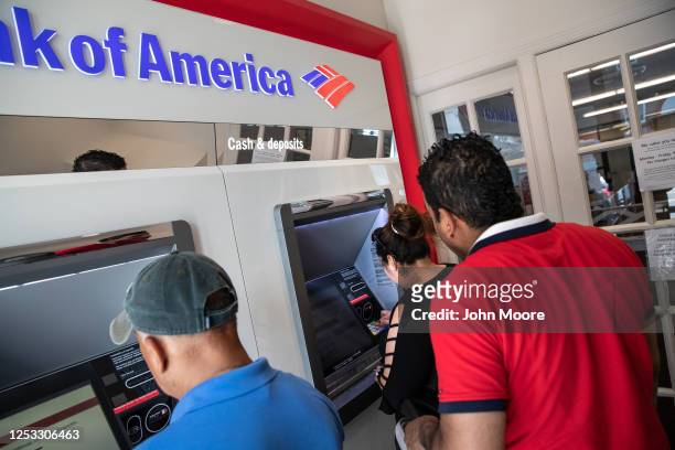 Zully makes her first ATM withdrawal with her husband Marvin on June 25, 2020 in Stamford, Connecticut. She, Marvin and their son Junior survived...