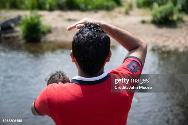 Marvin holds his son Neysel, 10 weeks, while at a park on June 25, 2020 in Stamford, Connecticut. Marvin, his wife Zully and their son Junior were...