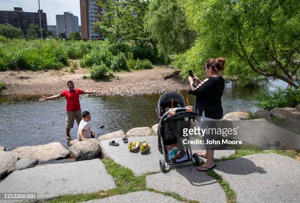 Zully photographs her husband Marvin and son Junior at a park on June 25, 2020 in Stamford, Connecticut. Marvin, Zully and Junior survived...