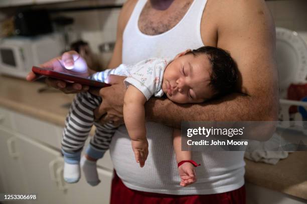 Marvin holds his son Neysel, 10 weeks, on June 17, 2020 in Stamford, Connecticut. Marvin, his wife Zully and their son Junior survived Covid-19...