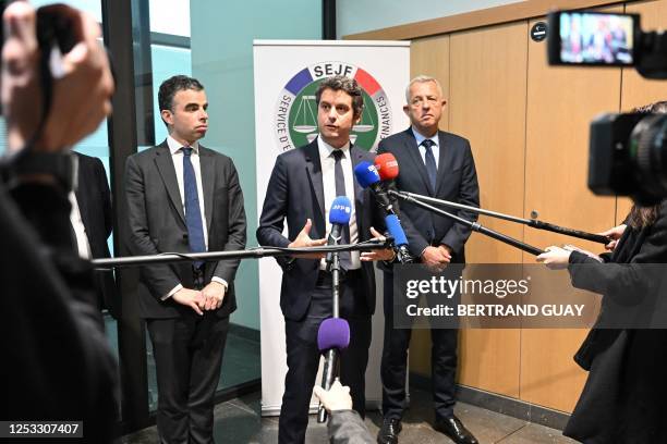 French Junior Minister for Public Accounts Gabriel Attal speaks to media next to SEJF director Christophe Perruaux during a visit at the judicial...