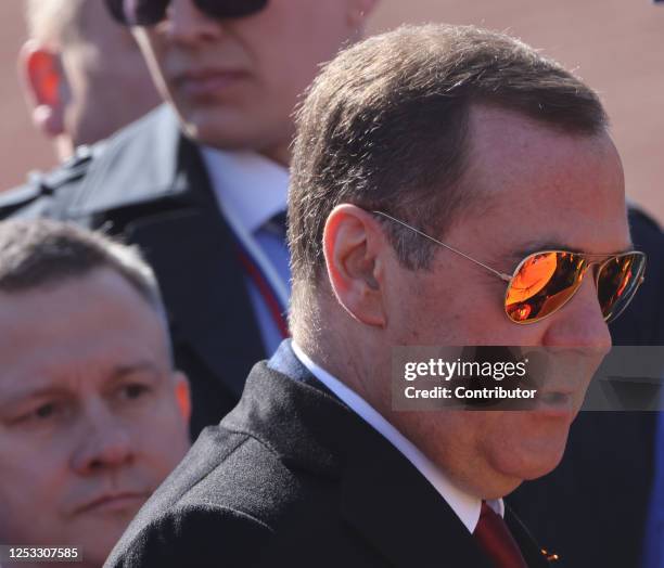 Russian Security Council Deputy Chairman Dmitry Medvedev wearing sunglasses arrives to the Victory Day Red Square Parade on May 9, 2023 in Moscow,...