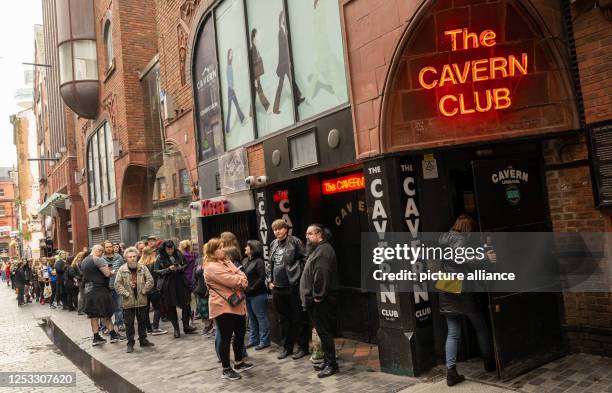 May 2023, Great Britain, Liverpool: Fans wait outside the legendary Cavern Club in the heart of the city for admission to see the group "Lord Of The...