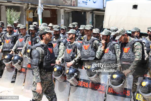 Pakistani security forces are seen outside the Islamabad High Court where former Prime Minister and Chairman of Pakistan Tehreeke-Insaf Imran Khan...