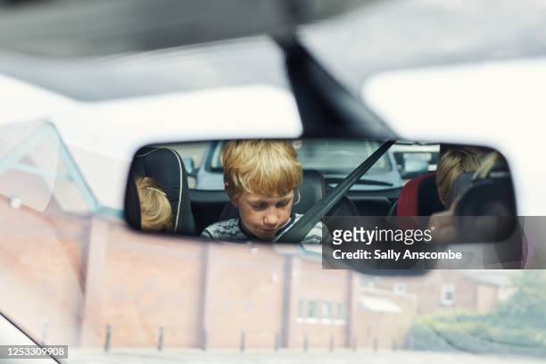 view of children in a car rear view mirror - rear view mirror stock pictures, royalty-free photos & images