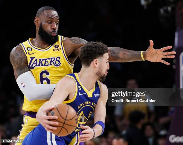 Los Angeles, CA, Monday, May 8, 2023 - Los Angeles Lakers forward LeBron James guards Golden State Warriors guard Klay Thompson in game four of the...