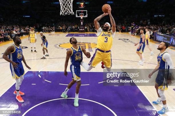 Los Angeles, CA, Monday, May 8, 2023 - Los Angeles Lakers forward Anthony Davis shoots over Golden State Warriors forward Andrew Wiggins in game four...