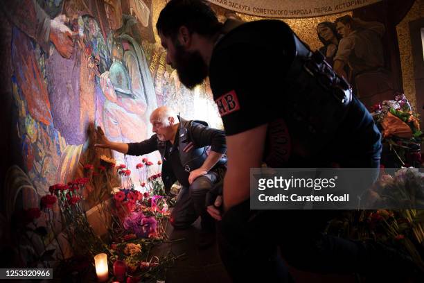 Members and supporters of the night wolf bikers club commemorate inside the tomb of the Soviet War memorial at the Soviet World War II memorial at...
