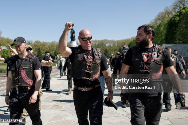 Men, including some who belong to the pro-Vladimir Putin "Night Wolves" biker club from Moscow, arrive to pay tribute to Soviet soldiers killed...