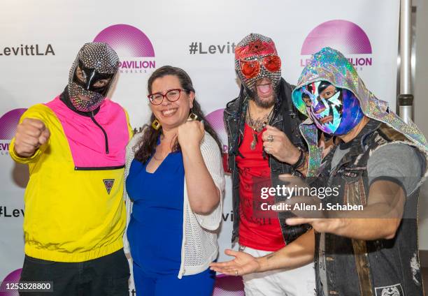 Los Angeles, CA Allegra Padilla, second from left, executive director of Levitt Pavilion Los Angeles, poses with El Conjunto Nueva Ola during a...