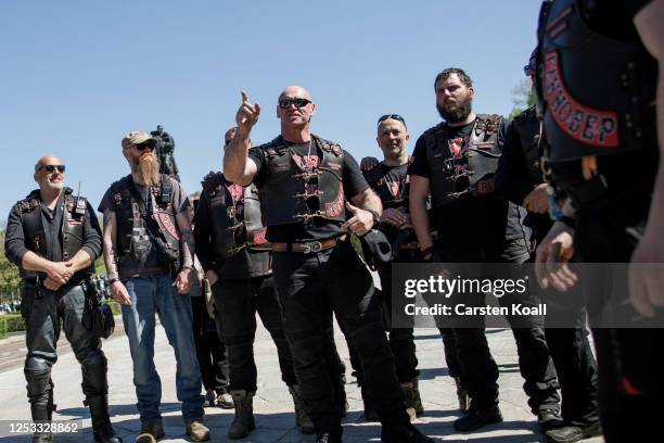 Men, including some who belong to the pro-Vladimir Putin "Night Wolves" biker club from Moscow, arrive to pay tribute to Soviet soldiers killed...