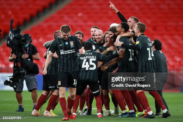 Northampton Town celebrate winning the Sky Bet League Two Play Off Final between Exeter City v Northampton Town at Wembley Stadium on June 29, 2020...