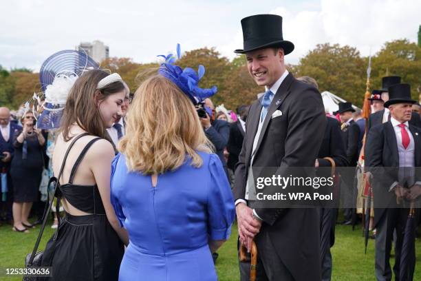 Prince William, Prince of Wales talks with guests during King Charles III's Coronation Garden Party at Buckingham Palace on May 9, 2023 in London,...