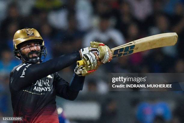 Royal Challengers Bangalore's Dinesh Karthik plays a shot during the Indian Premier League Twenty20 cricket match between Mumbai Indians and Royal...