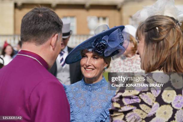 Britain's Sophie, Duchess of Edinburgh talks to guests during a Garden Party at Buckingham Palace in London on May 9 as part of the Coronation...